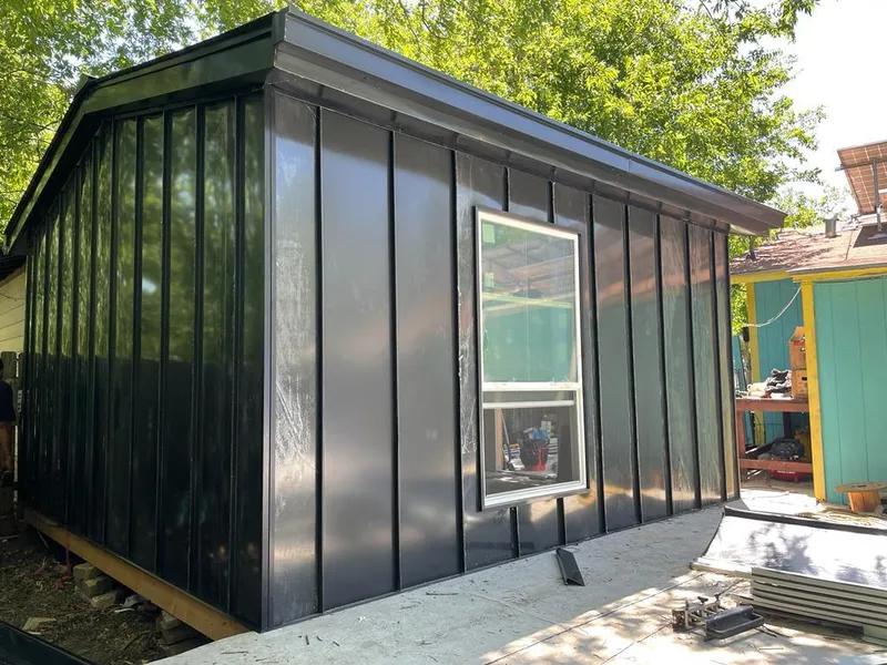 Black standing seam metal wall panels for Metal Roof Installation in Fitchburg