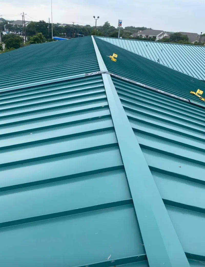 Green commercial metal roof ridge and valley for Metal Roof Repair in Fitchburg
